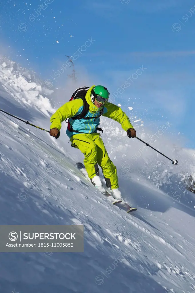 Austria, Tyrol, Kitzbuehel, Man off-piste skiing