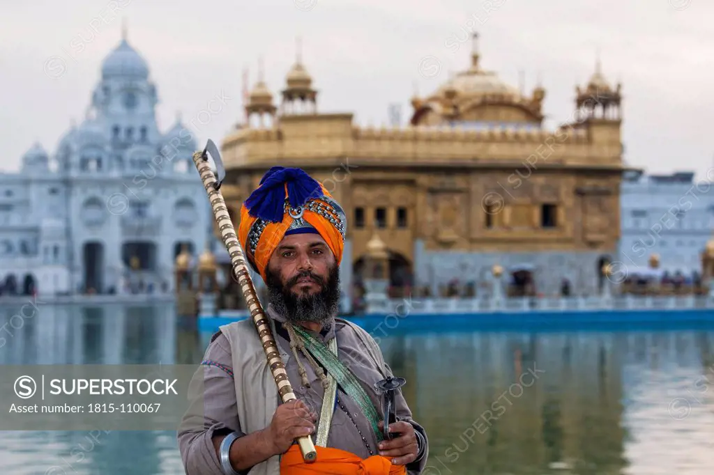 India, Punjab, Amritsar, Senior man with Akali Nihang at Golden Temple