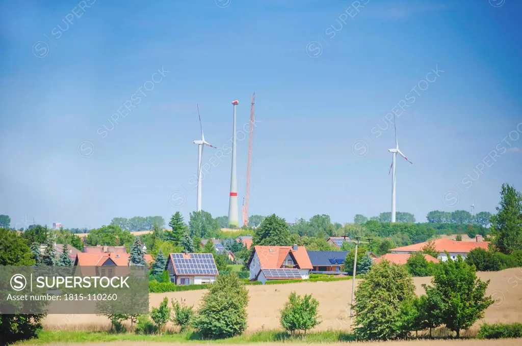 Germany, Saxony, View of wind turbine with solar panel in wind park