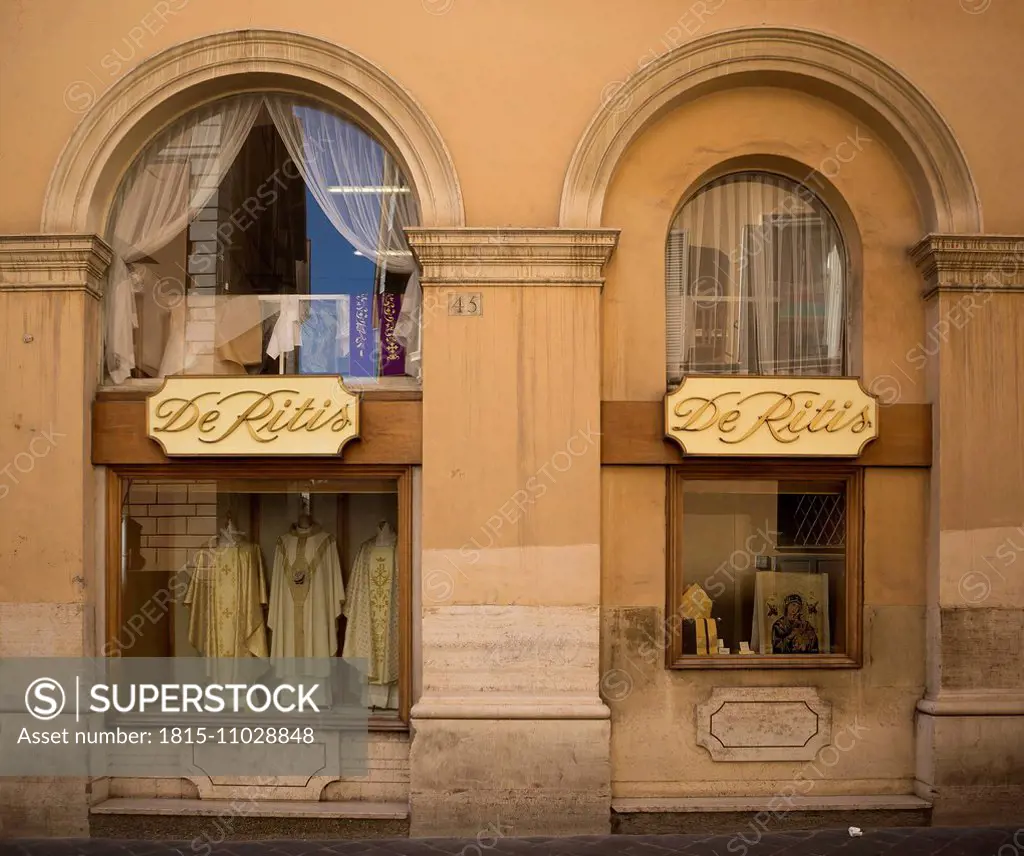 Italy, Rome, view to windows of shop which sells clothing for priests