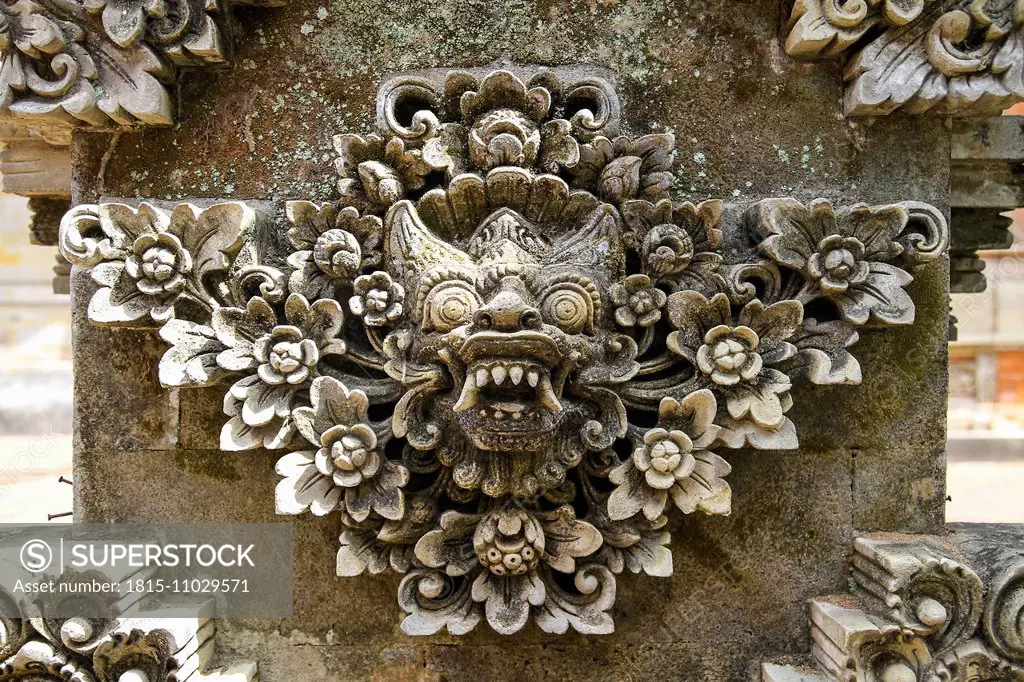 Indonesia, Bali, Batuan Temple, view to sculpture of Hindu god, close-up