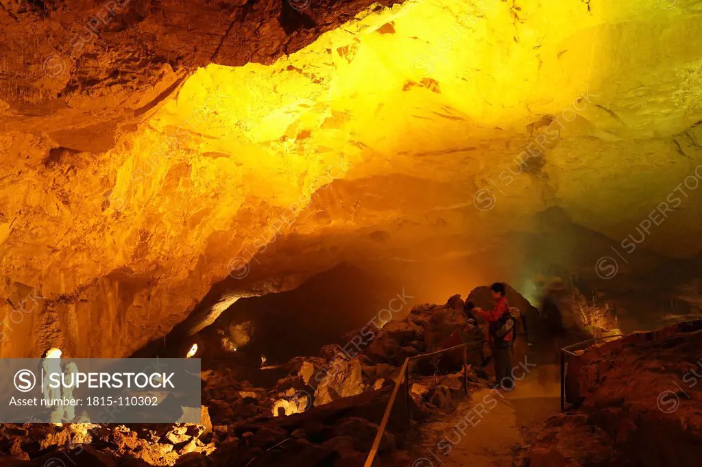 Austria, Styria, Person at Lurgrotte stalactite cave