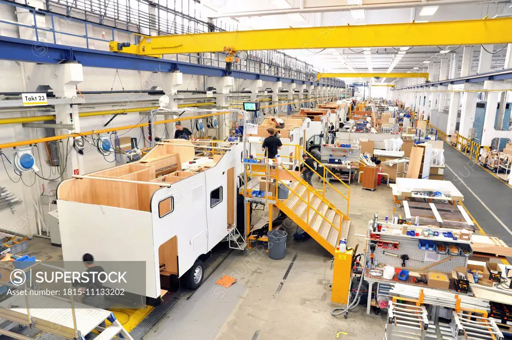 Assembly line production of motorhomes in a factory