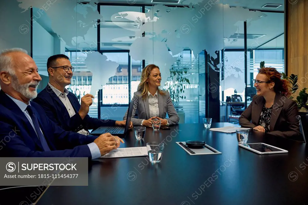 Group of happy business people having a meeting