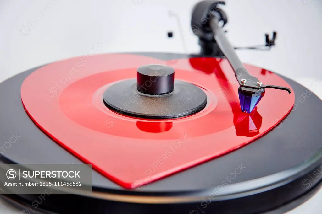 Heart-shaped vinyl record on record player