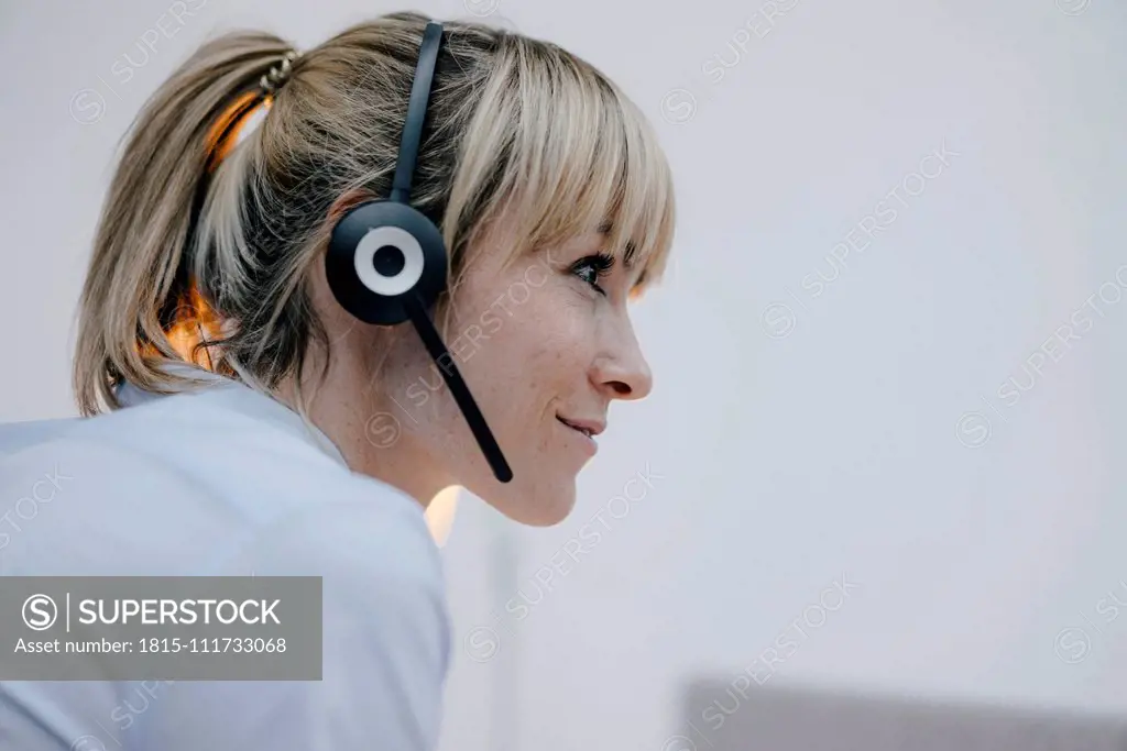 Businesswoman having a conference call with headset