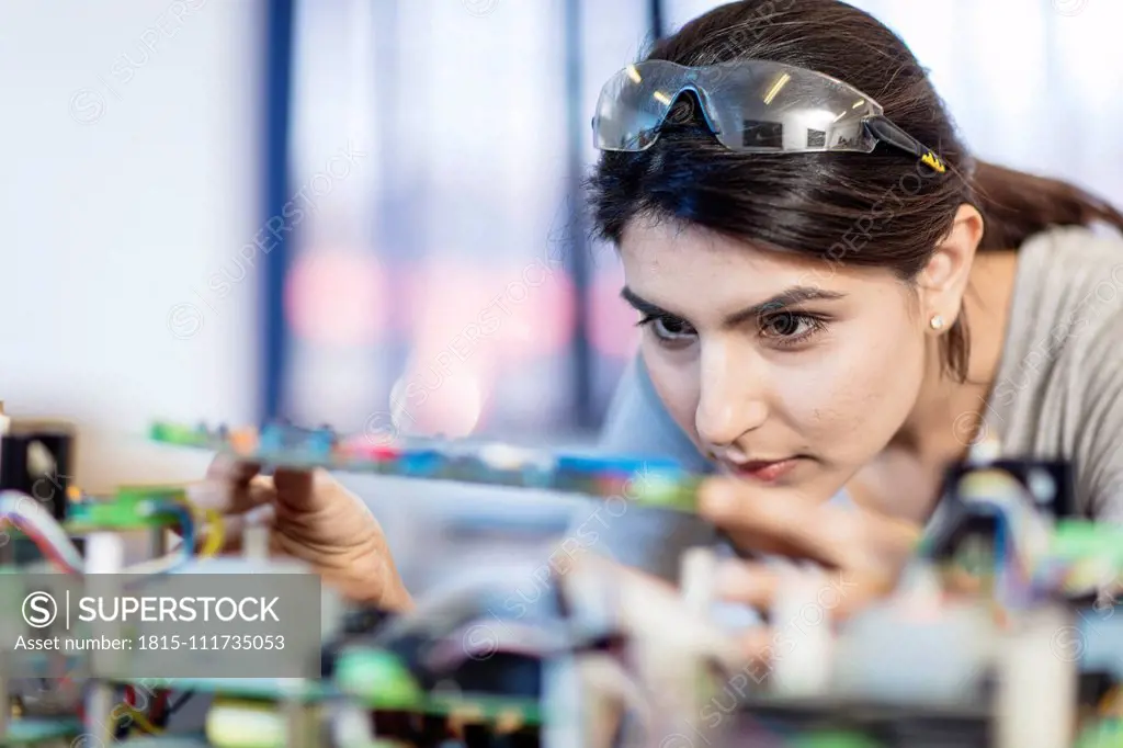 Woman working on computer equipment