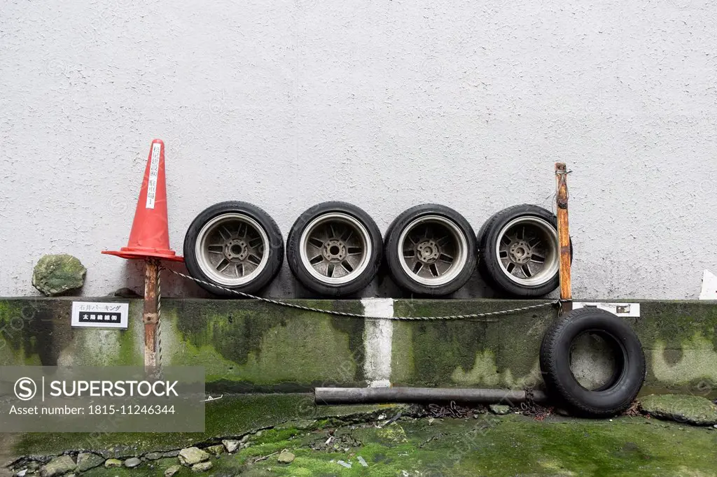Traffic cone and car tyres