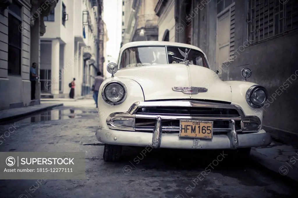 Cuba, parking white vintage car on a road