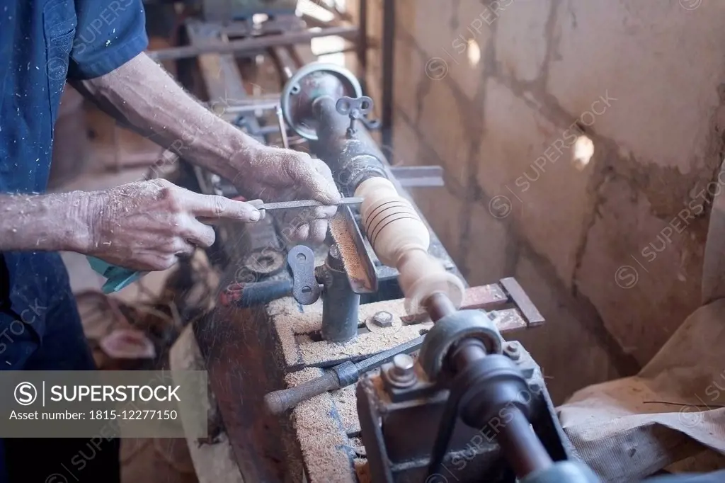 Cuba, Matanzas, Jaguey Grande, woodworker's hands at work