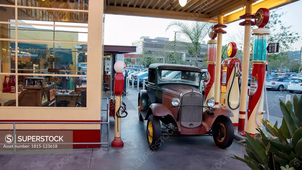 USA, California, Los Angeles, Vintage car with gasoline station at mall