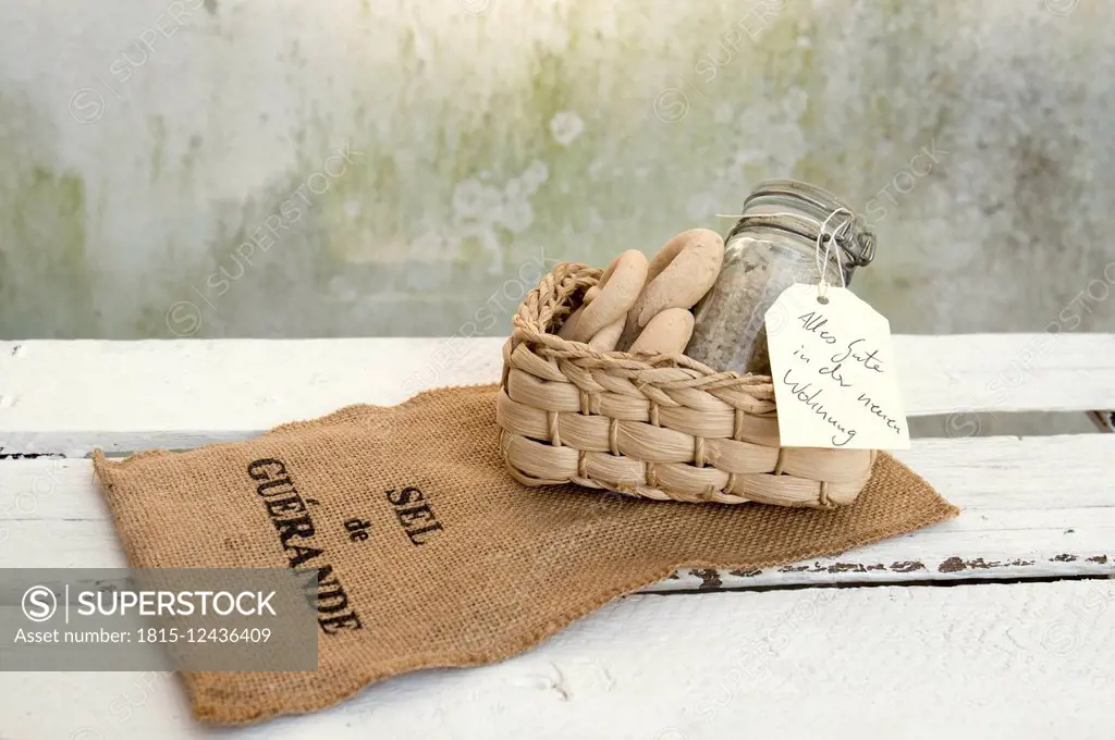 Welcome gift, sea salt and bread in basket, jute