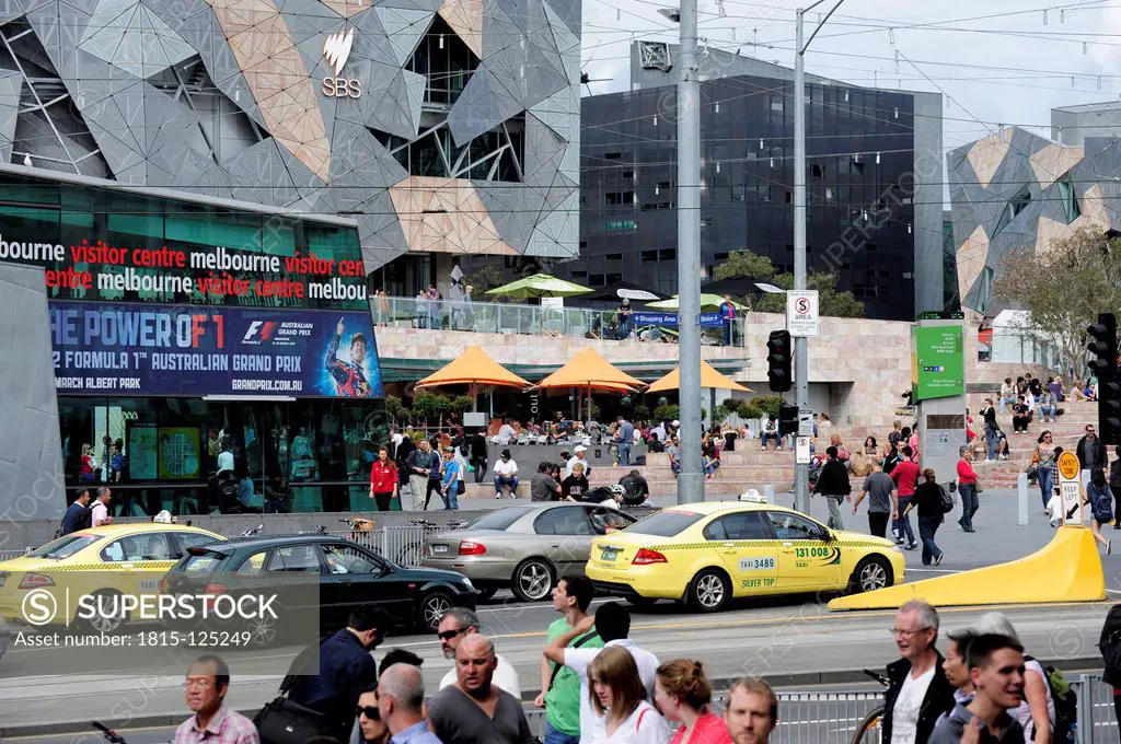 Australia, Victoria, Traffic in front of Federation Square at Flinders Street