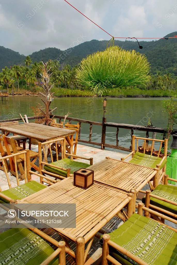Thailand, Bar cafe restaurant with terrace on pier in Bang Bao bay at Mu Ko Chang National Park