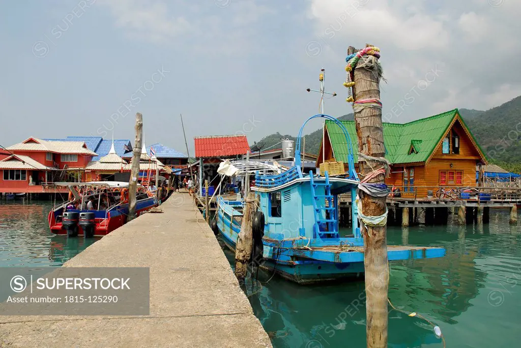 Thailand, Pier with boats and buildings on Bang Bao bay at Mu Ko Chang National Park