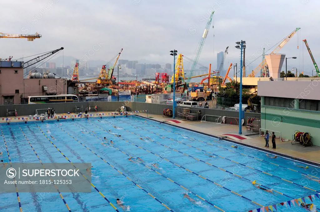 China, Hong Kong, Construction area at Victoria Harbour behind swimming pool in Wan Chai