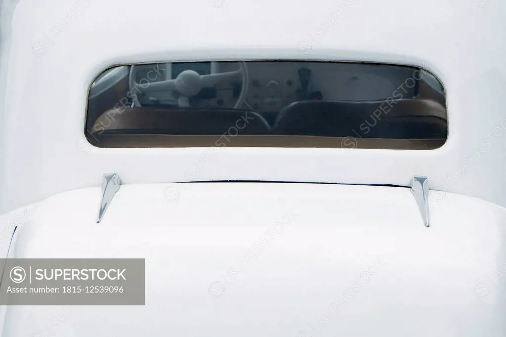 Rear window of white Citroen 11CV