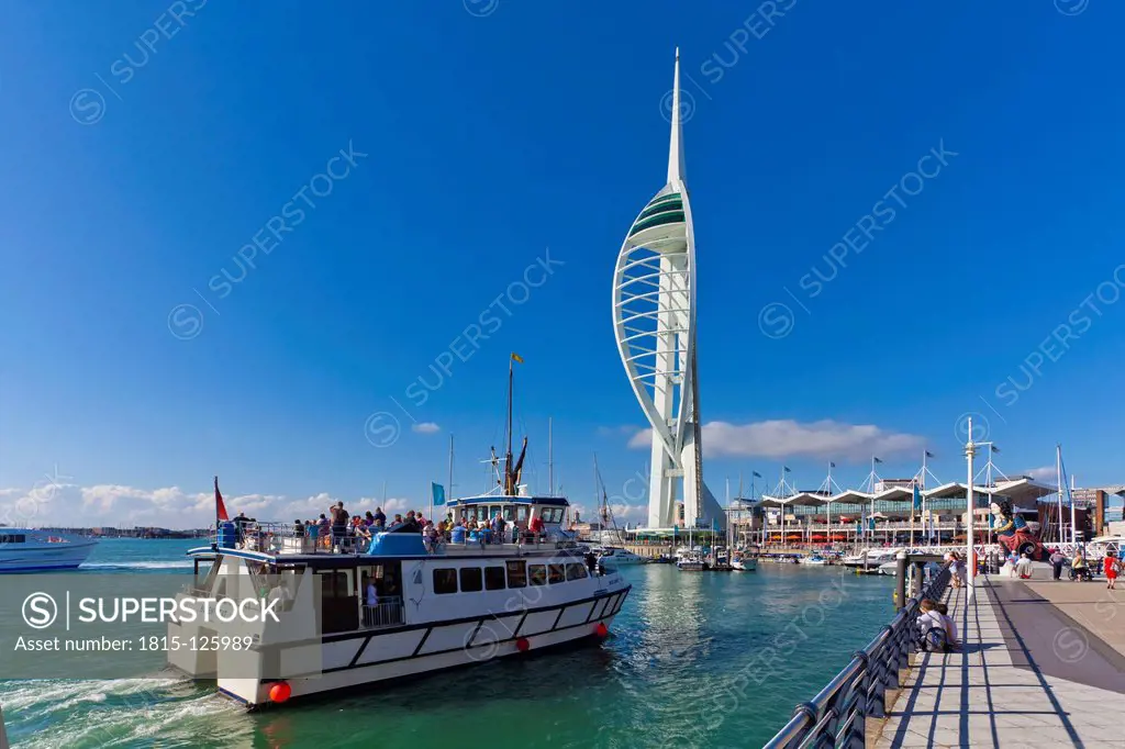 England, Hampshire, Portsmouth, View of excursion boat in harbour and Spinnaker Tower in background