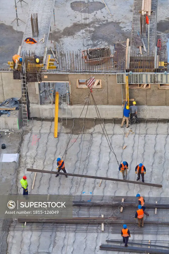 Germany, Baden Wuerttemberg, Stutttgart, Building workers working in steel reinforcement at construction site
