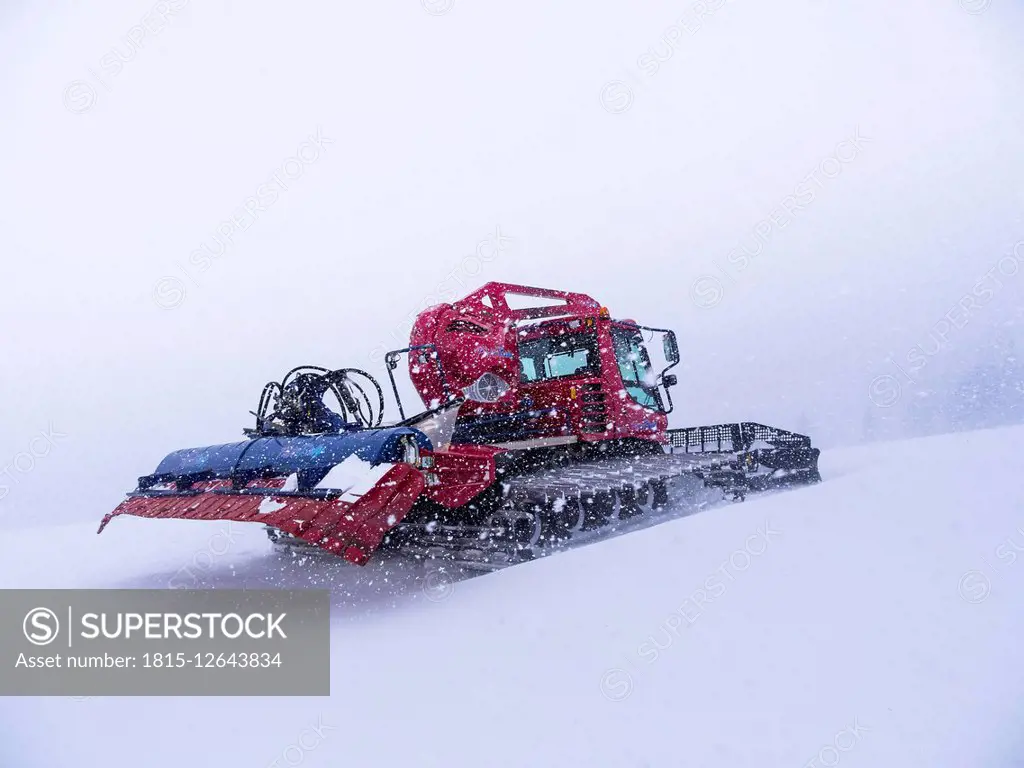 Austria, Kitzbuehel Region, winter landscape with snowcat