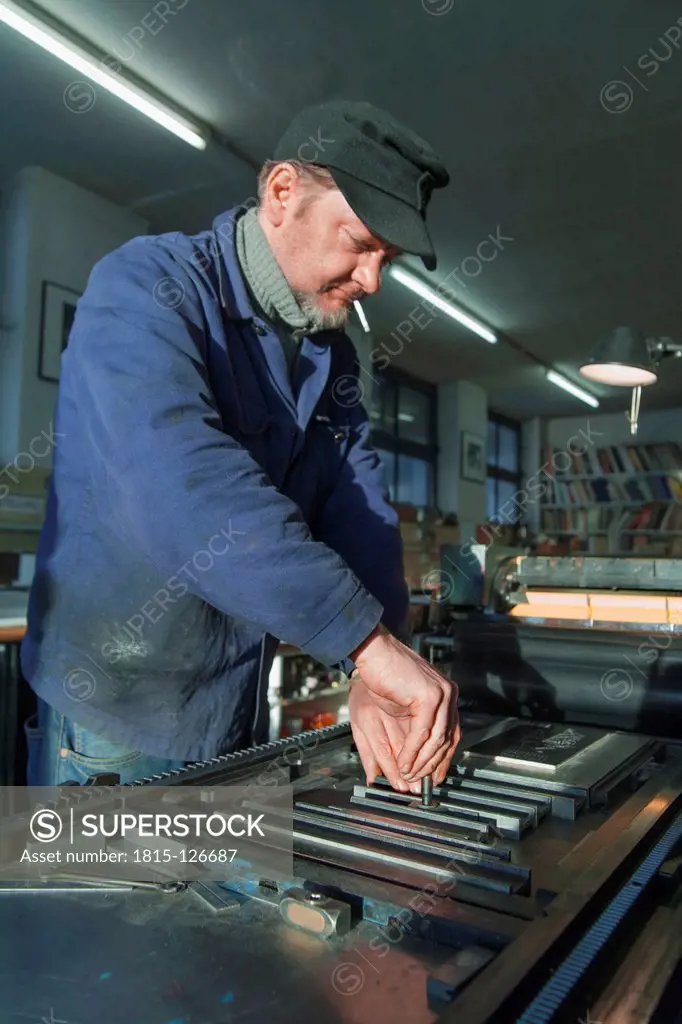 Germany, Bavaria, Man working in print shop