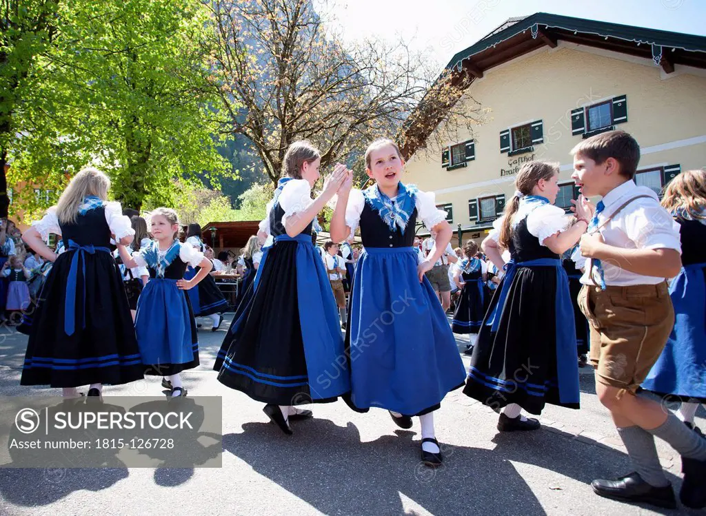 Austria, Boy and girls dancing on street