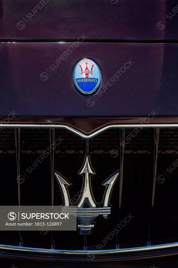 Germany, Bavaria, Maserati company logo on Maserati Quattroporte, close up