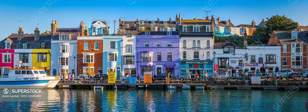 United Kingdom, Dorset, Weymouth, colourful harbour houses at seaside