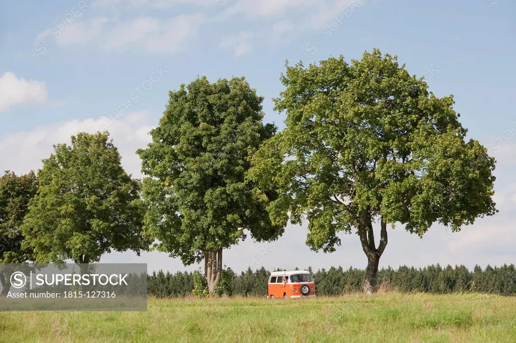 Germany, Bavaria, Camping bus on landscaped meadow