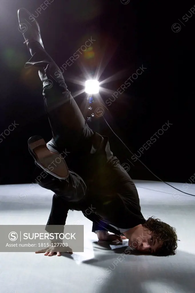 Actor performing stunt on stage