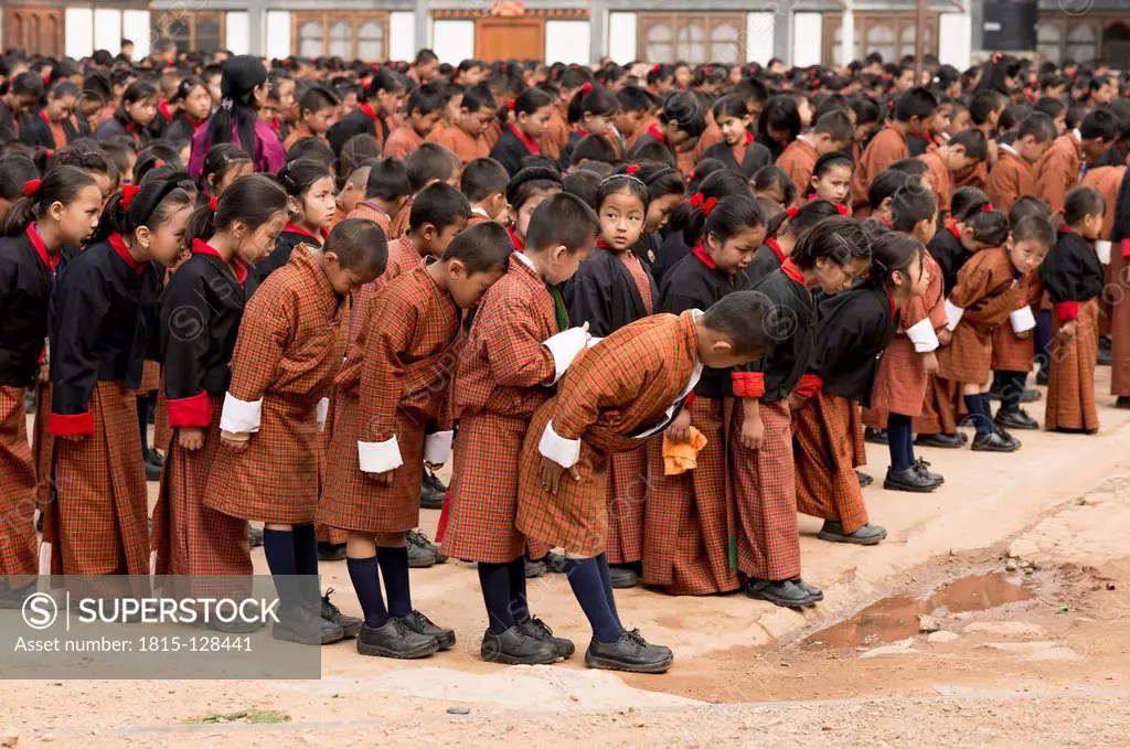 Bhutan, Children standing in row for morning prayer