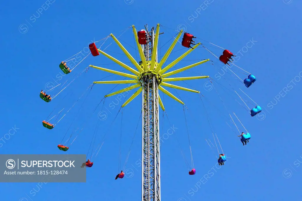 Germany, Chairoplane against blue sky