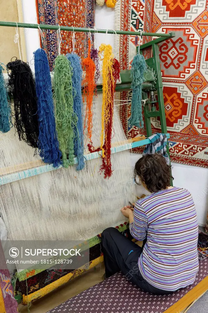 Turkey, Woman preparing Desen Halicilik Carpet