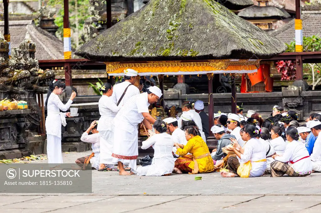 Indonesia, People sitting at Pura Penataran Agung temple