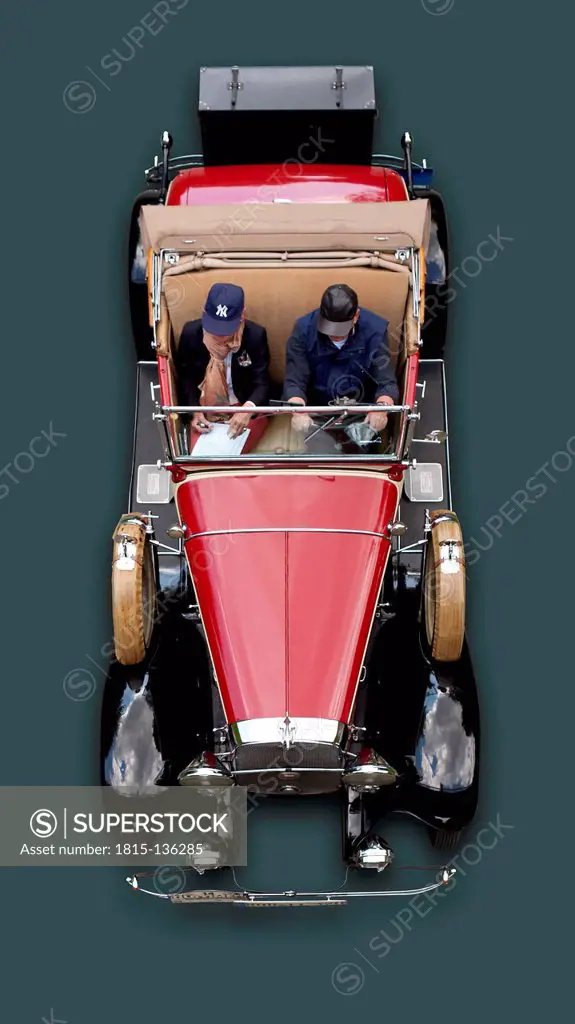 Germany, Hesse, Senior man and mature woman sitting in Chevrolet Independence Phaeton