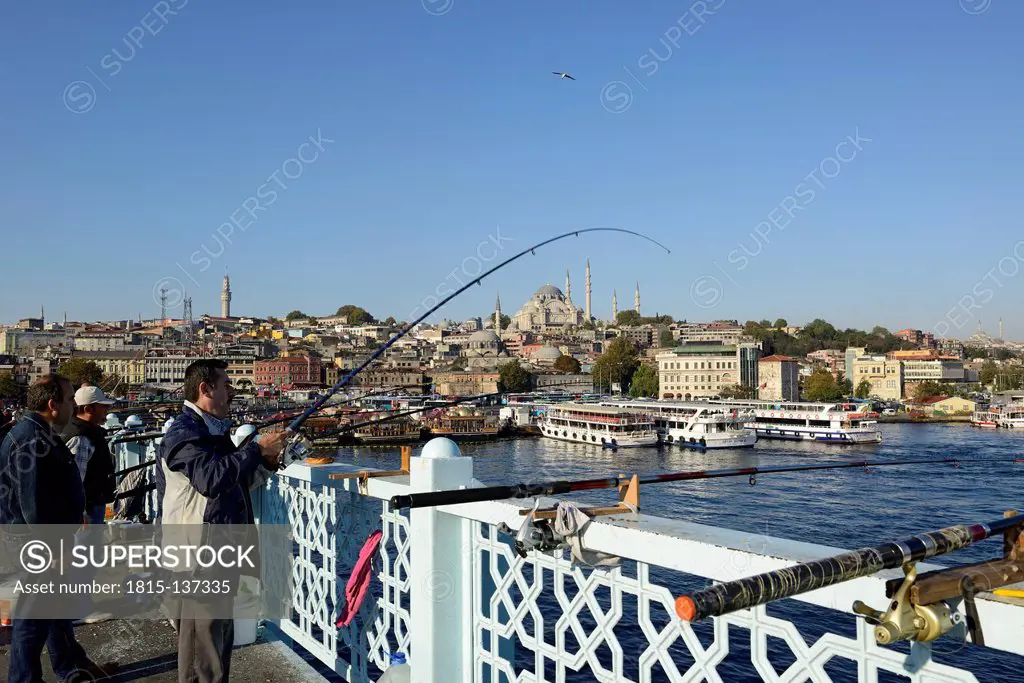 Turkey, Istanbul, Anglers standing on the Galata Bridge
