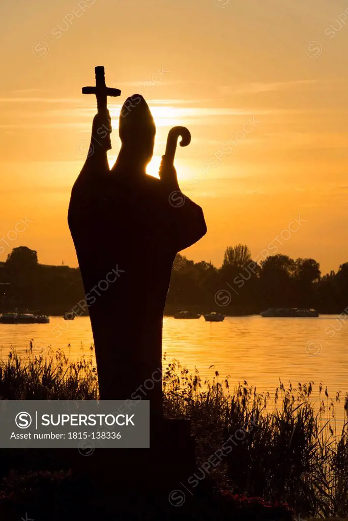 Germany, Statue of Holy Pirmin at sunset