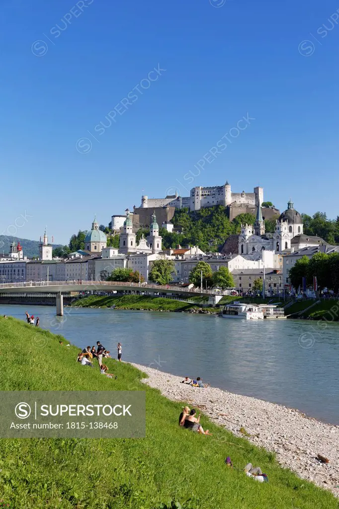 Austria, Salzburg, View of Collegiate Church and Hohensalzburg Castle at Makartsteg Bridge