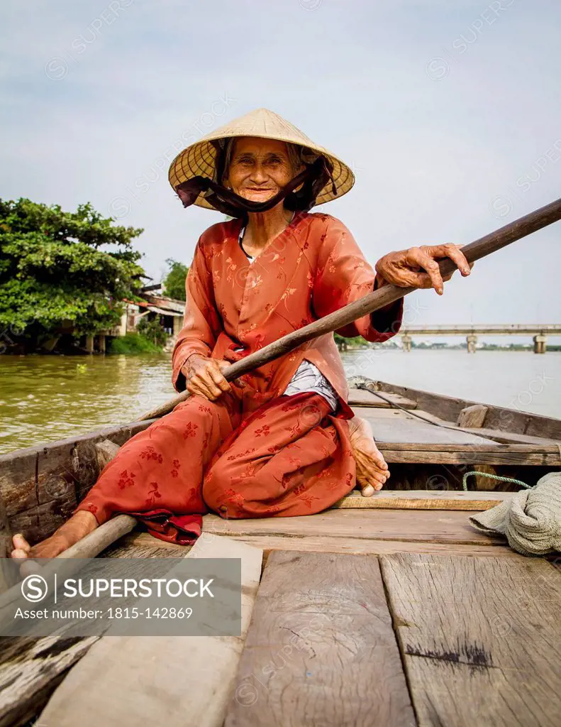 Vietnam,Hoi An, Old vietnamese lady on rowing boat