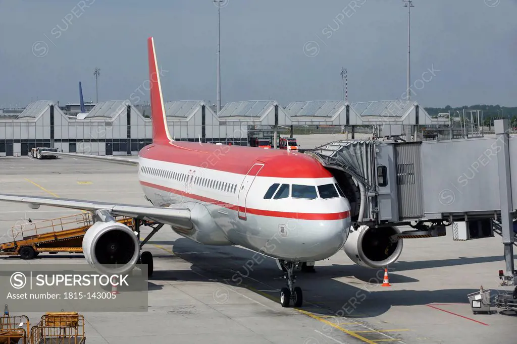 Germany, Bavaria, Munich, Aircraft A 320 on airport apron boarding