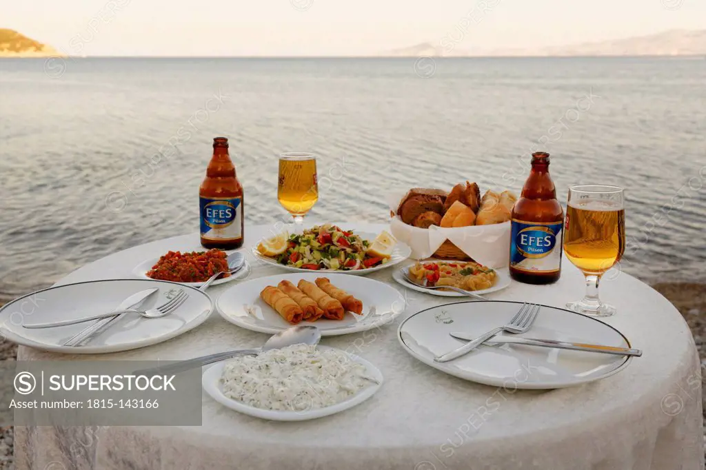 Turkey, Mixed appetizers with efes beer on table