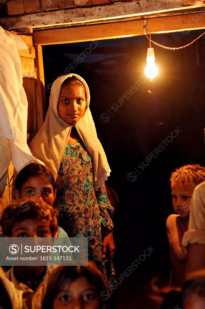 Pakistan, Punjab, Youhanabad, Children gathering in simple hut