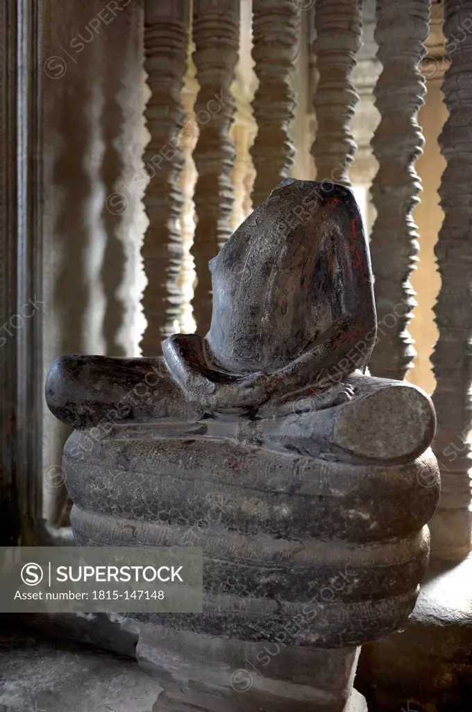 Cambodia, Siem Reap, Angkor Wat, headless Buddha sitting on Naga