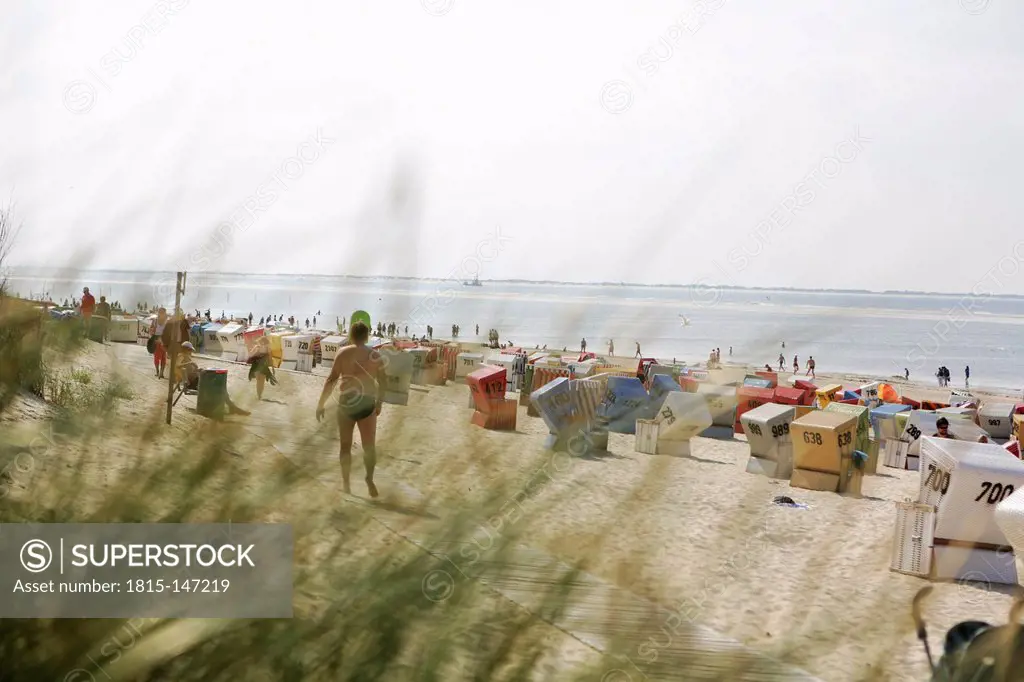 Germany, Lower Saxony, East Frisia, Langeoog, roofed wicker beach chairs at the beach