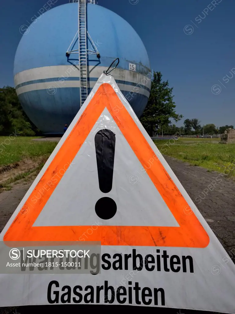 Germany, Baden-Wurttemberg, Gas tank of water treatment plant and warning sign