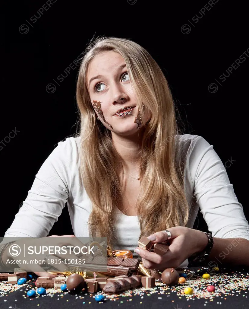 Teenage girl eating chocolate