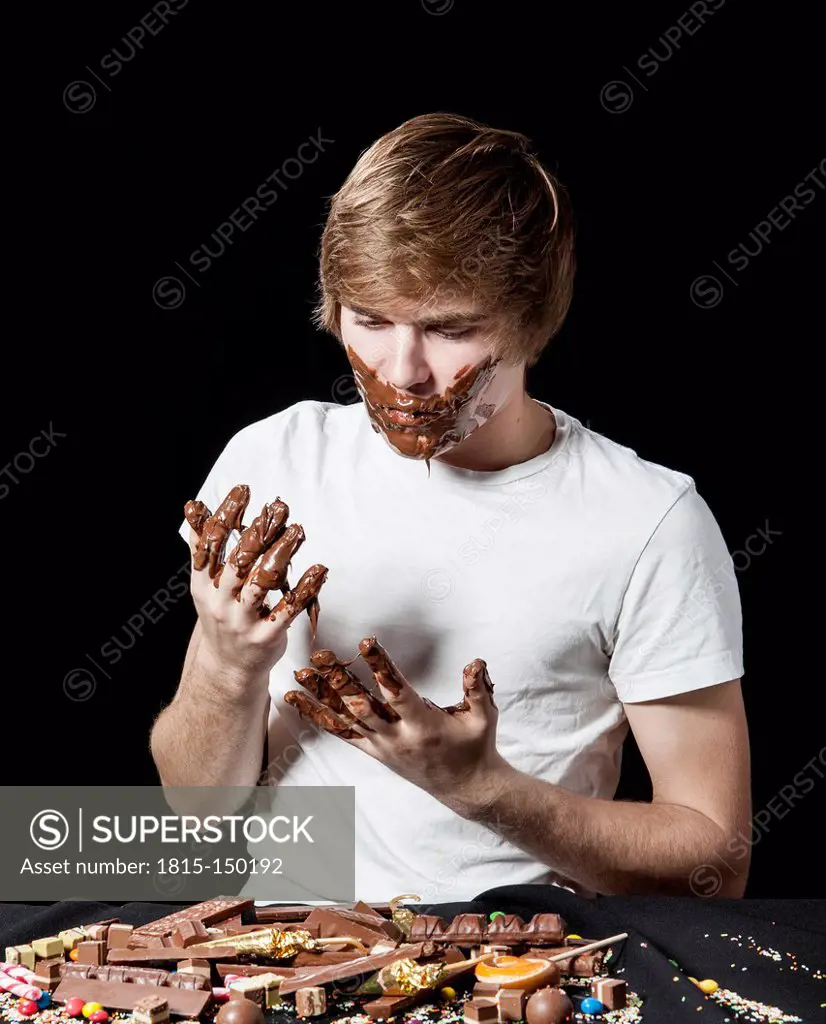 Teenage boy eating chocolate spread