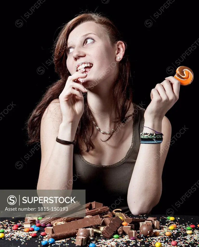 Teenage girl with lollipop and sweets