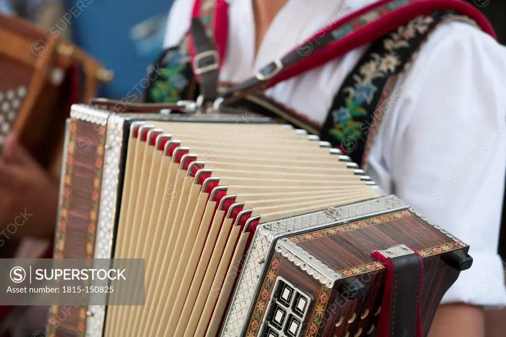 Germany, Bavaria, Wallgau, Man playing accordion