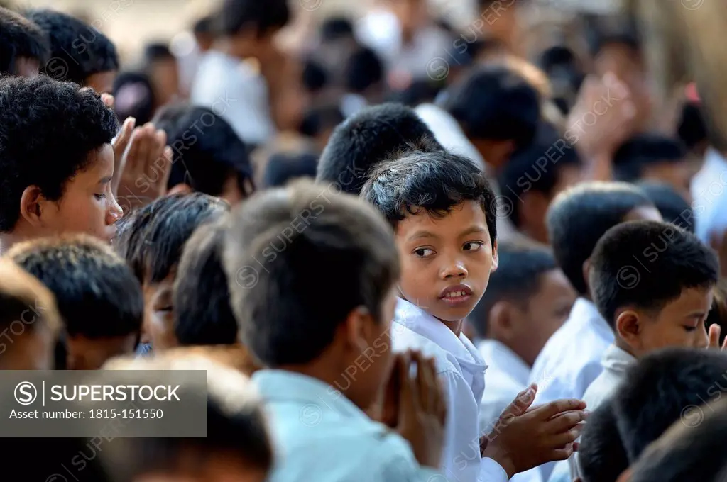 Cambodia, Takeo Province, Lompong, Praying pupils awaiting New Year's festival
